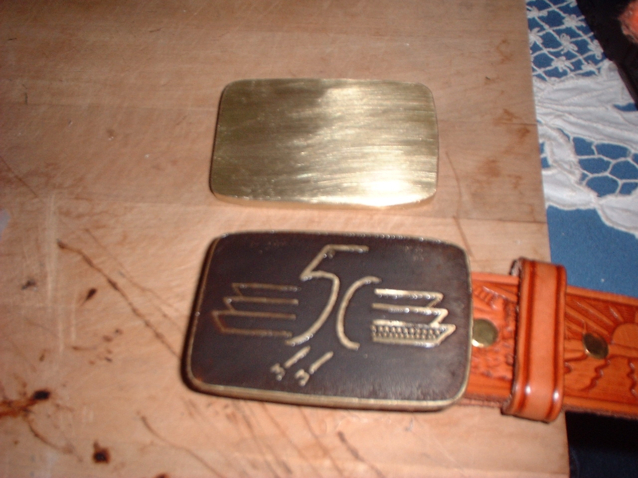 The etched buckle after being darkened (antiqued).